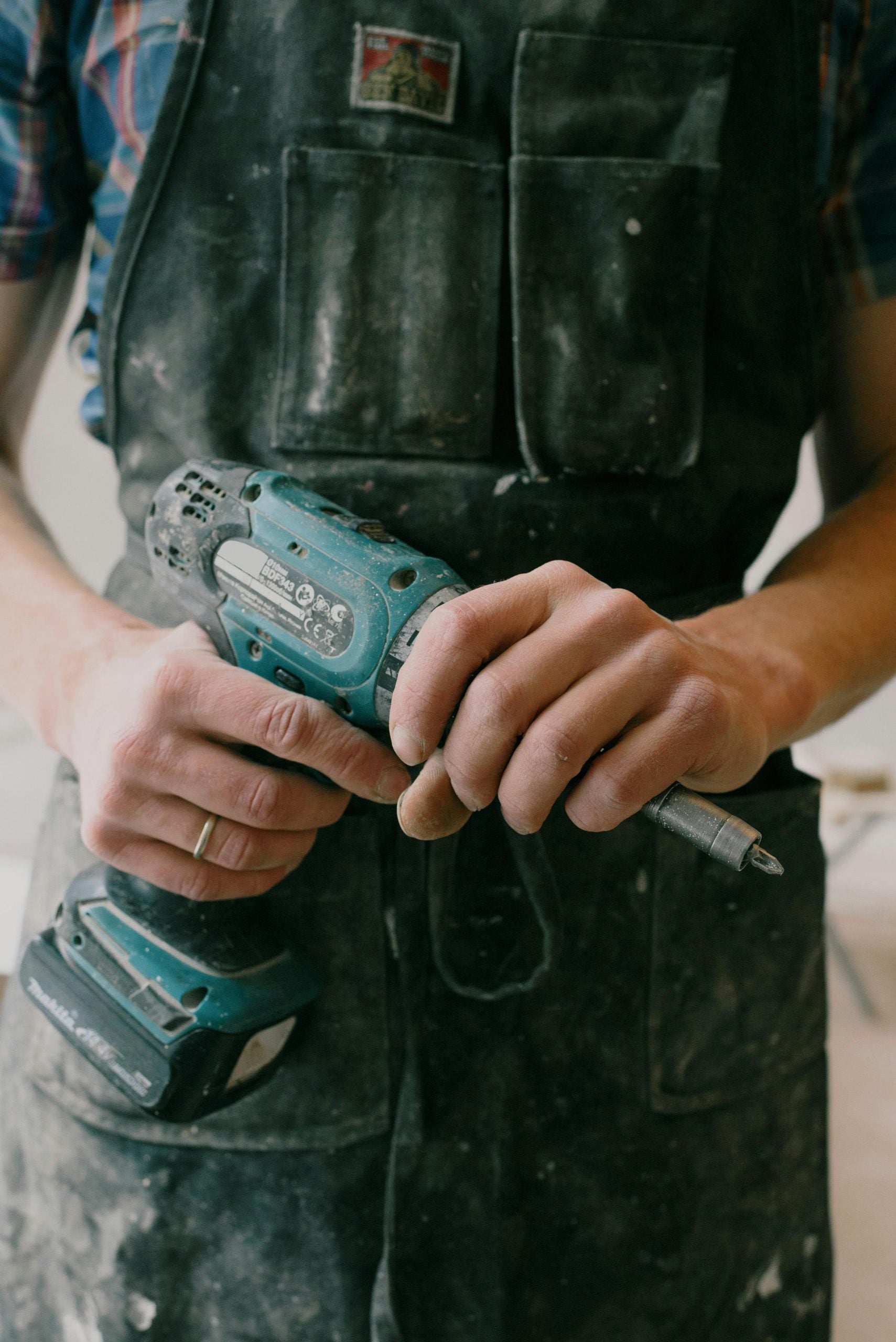 maintenance contractor holding drill