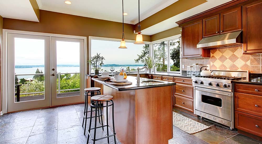 kitchen with warm wood cabinets and ocean view